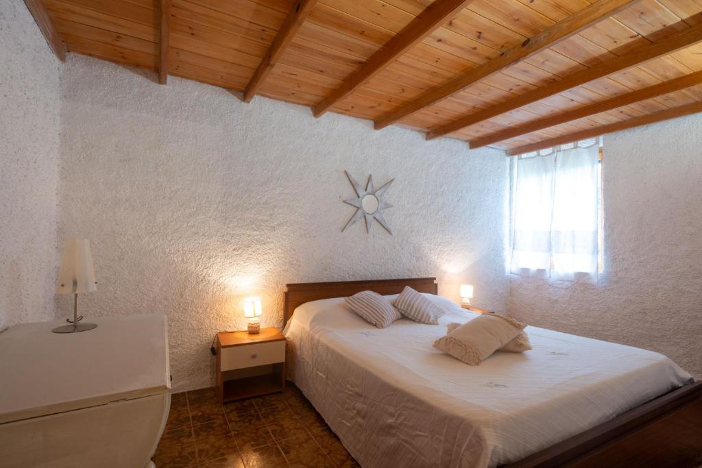 Postel nebo postele na pokoji v ubytování Rustico Gallurese