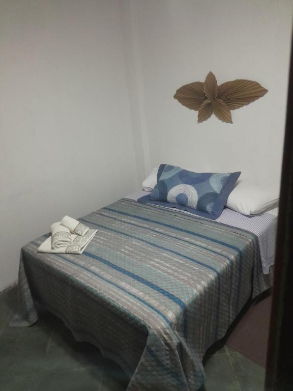 Una cama o camas en una habitación de Suíte Monte Cielo