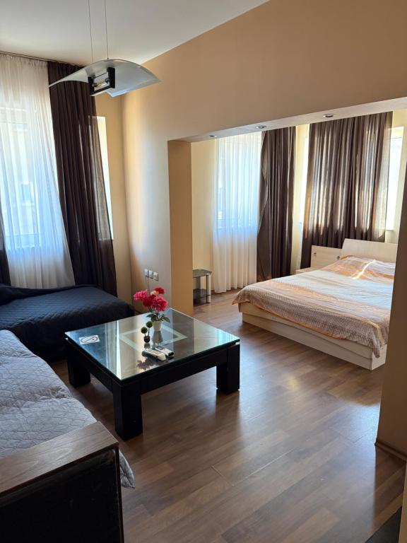A bed or beds in a room at Guest House Elegance