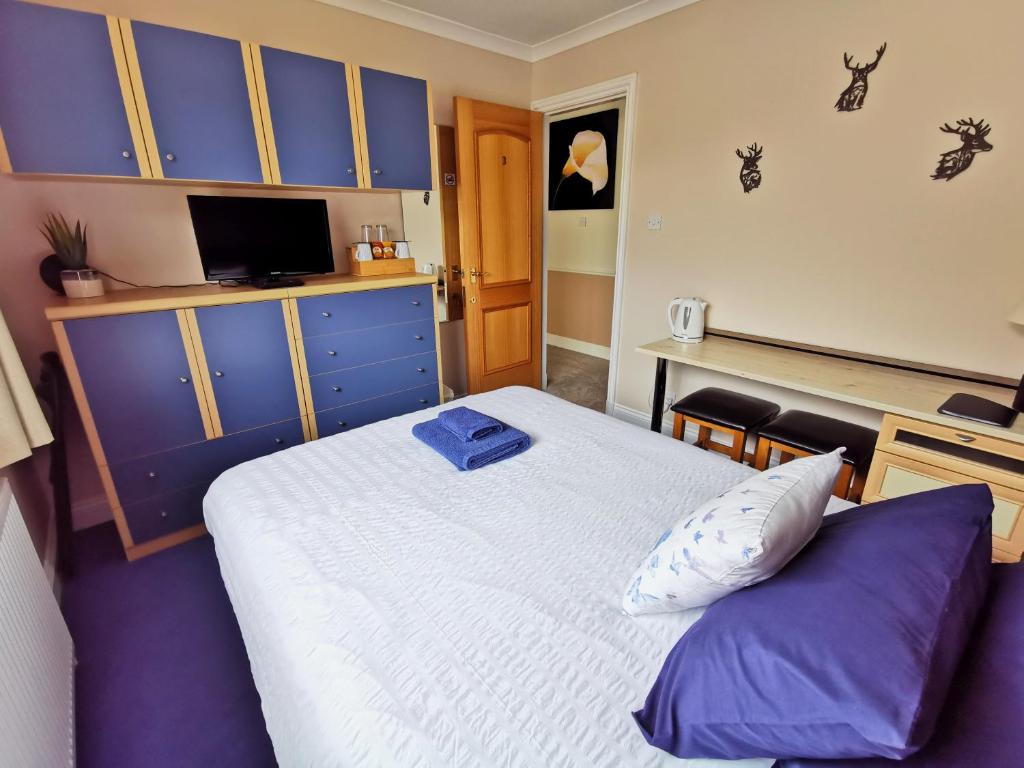 Postel nebo postele na pokoji v ubytování Loch Eyre Oasis