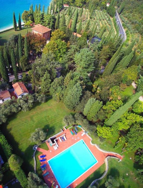 an aerial view of a estate with a swimming pool at [Exclusive Villa Punta San Vigilio] in Garda