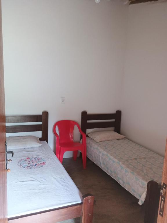 เตียงในห้องที่ Chácara Cachoeira