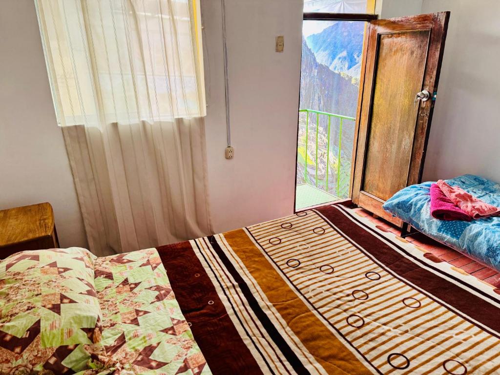 Postel nebo postele na pokoji v ubytování Ukumari Hostel