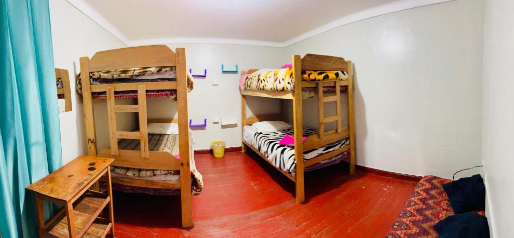 Postel nebo postele na pokoji v ubytování Ukumari Hostel