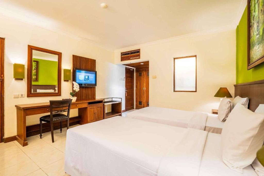 Postel nebo postele na pokoji v ubytování Risata Bali Resort & Spa