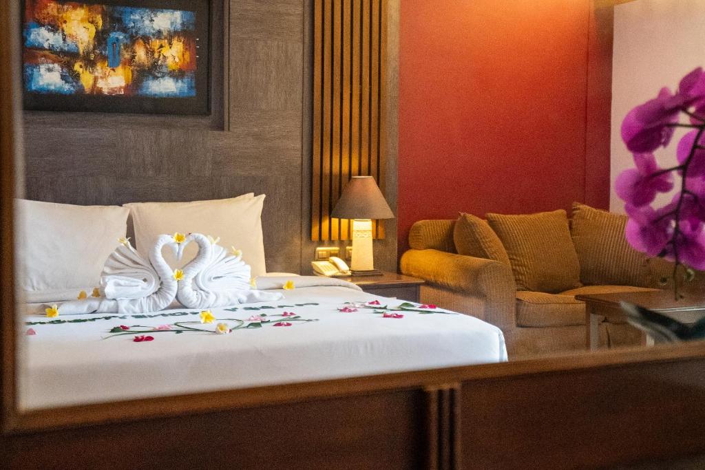 Postel nebo postele na pokoji v ubytování Risata Bali Resort & Spa