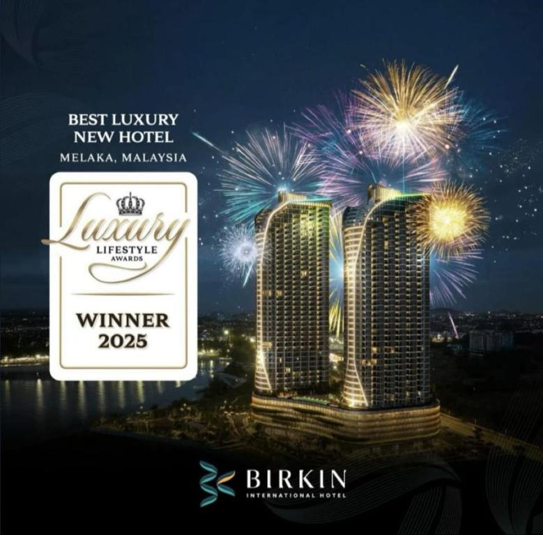 a sign for the new luxury new hotel with fireworks at Birkin International Hotel in Melaka