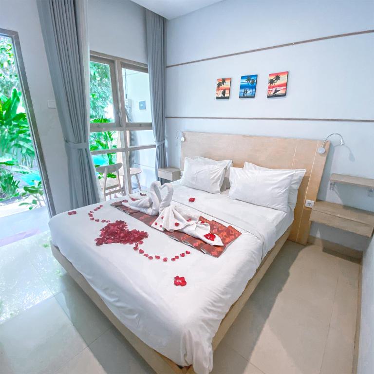 Postel nebo postele na pokoji v ubytování Manuver Surf And Stay Uluwatu Bali