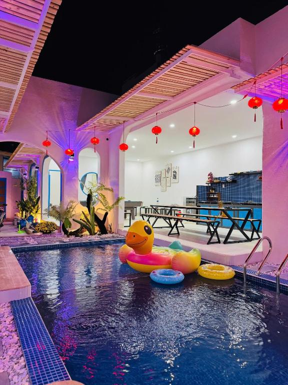 a pool with a rubber duck in the middle at MON House 2 in Ấp Sung Xuân