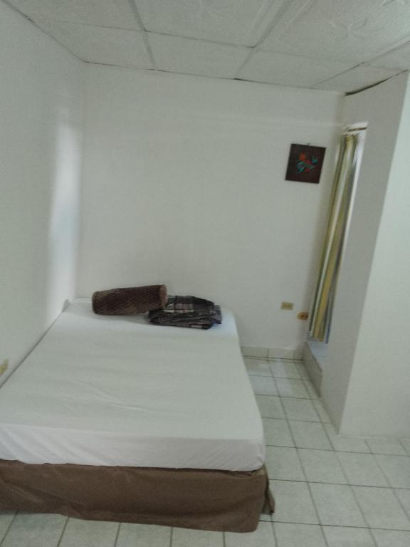 Voodi või voodid majutusasutuse Cobán room toas