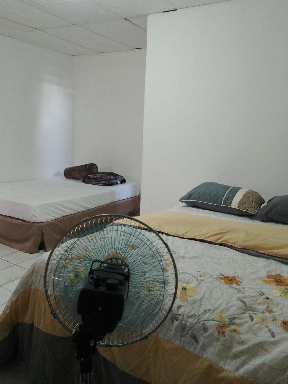 Voodi või voodid majutusasutuse Cobán room toas