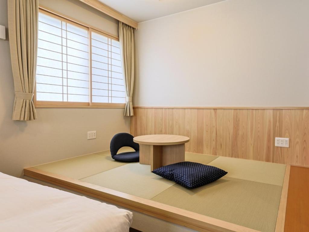 Postel nebo postele na pokoji v ubytování Hotel Kii Tanabe