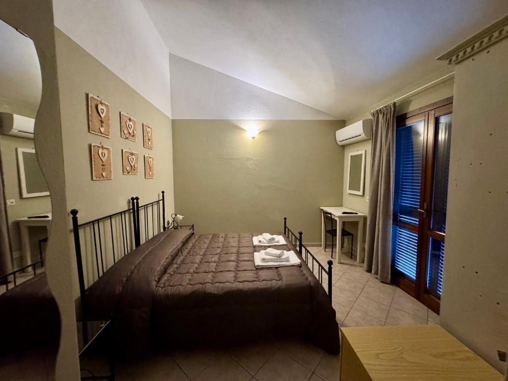 Postel nebo postele na pokoji v ubytování I Puntoni Agriturismo
