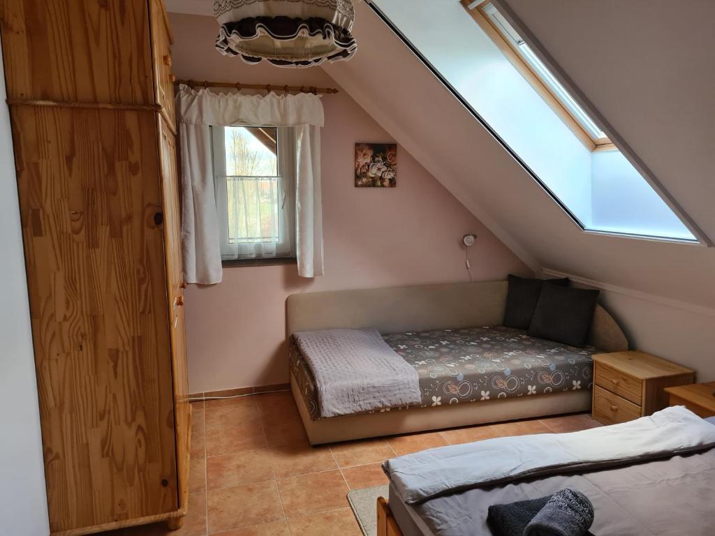 Postel nebo postele na pokoji v ubytování Slunečnice - Ubytování v soukromí na Třeboňsku