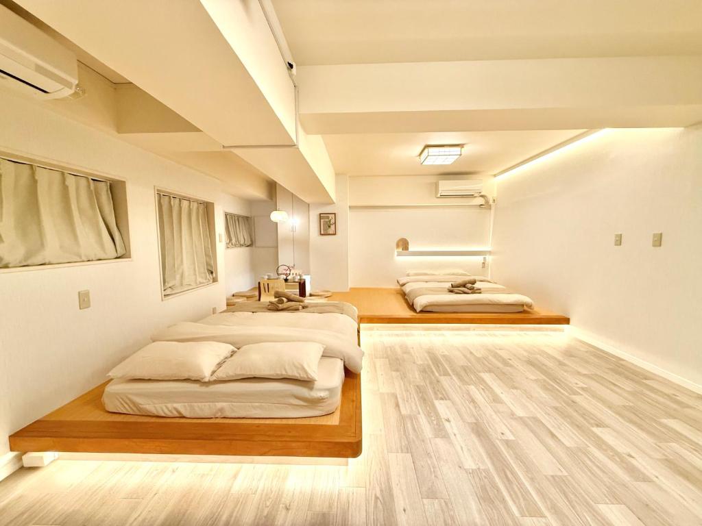 Letto o letti in una camera di 桜南大塚ハウス i