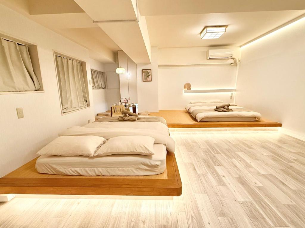 Letto o letti in una camera di 桜南大塚ハウス i