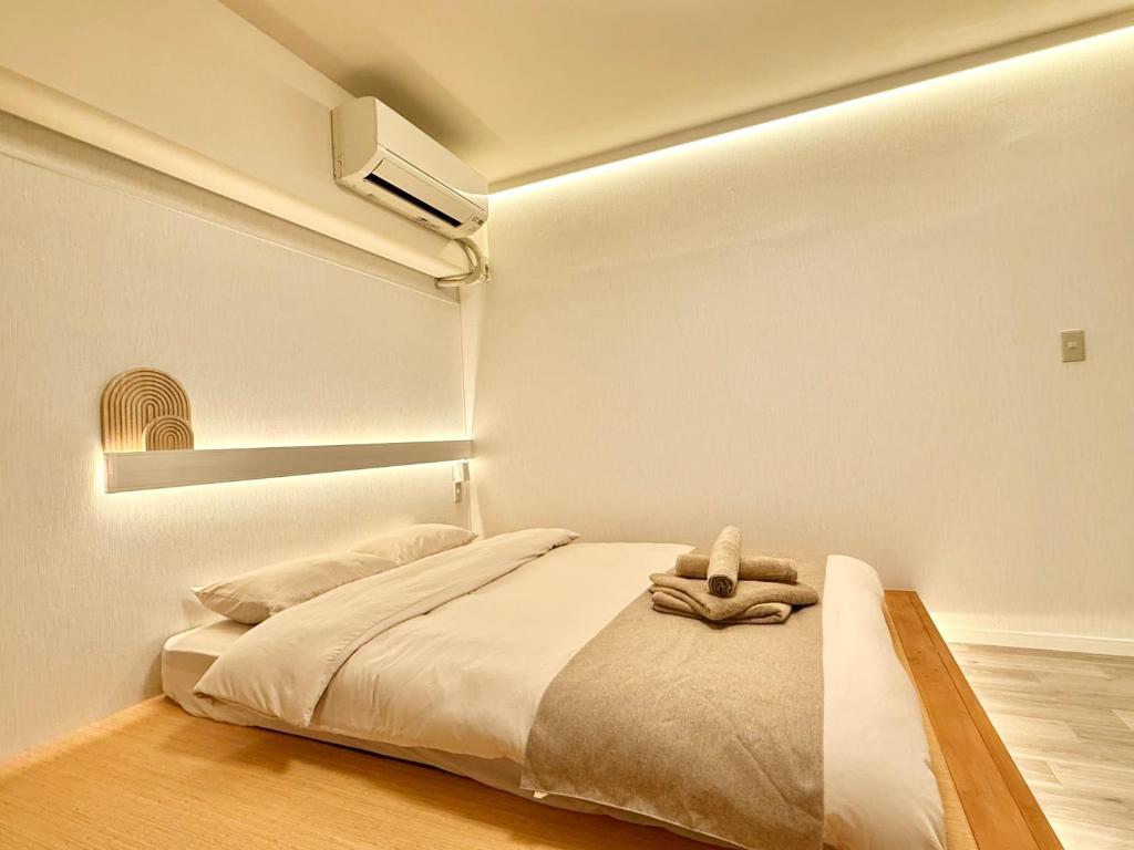 Letto o letti in una camera di 桜南大塚ハウス i