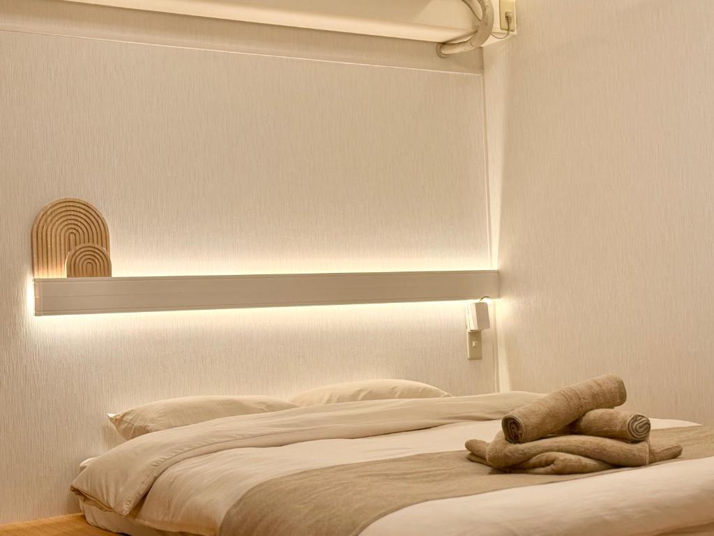 Letto o letti in una camera di 桜南大塚ハウス i