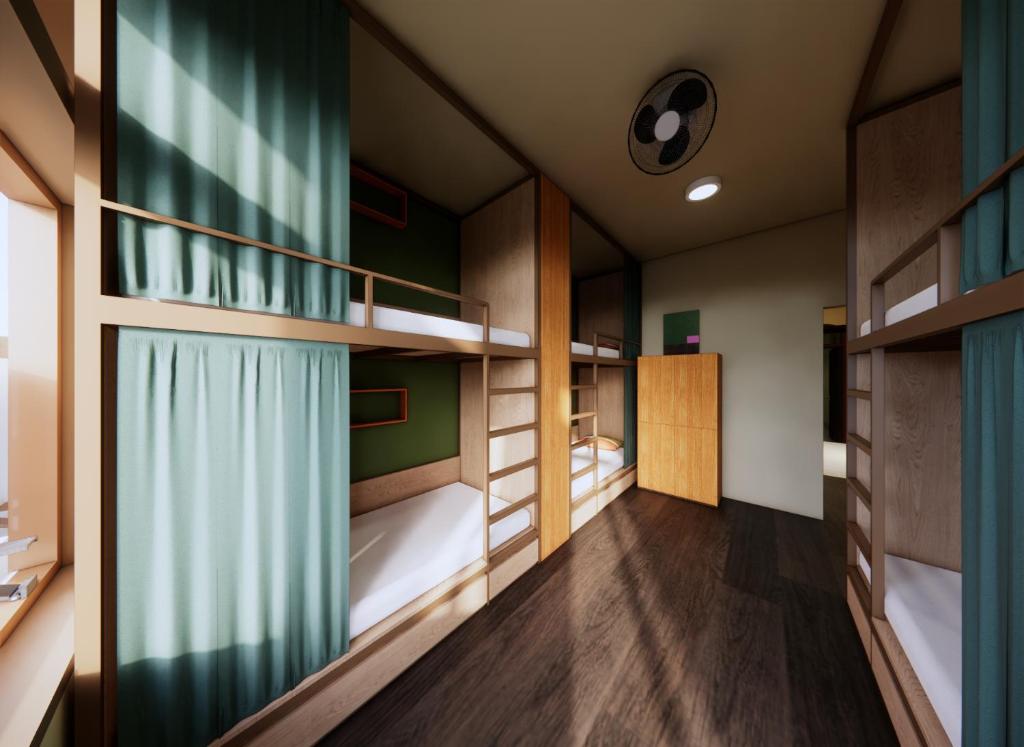 Postel nebo postele na pokoji v ubytování Rebel Rooster Hostel