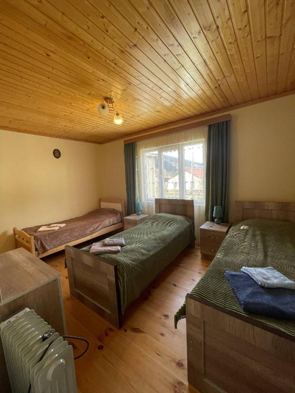 Postel nebo postele na pokoji v ubytování Guesthouse Daelani