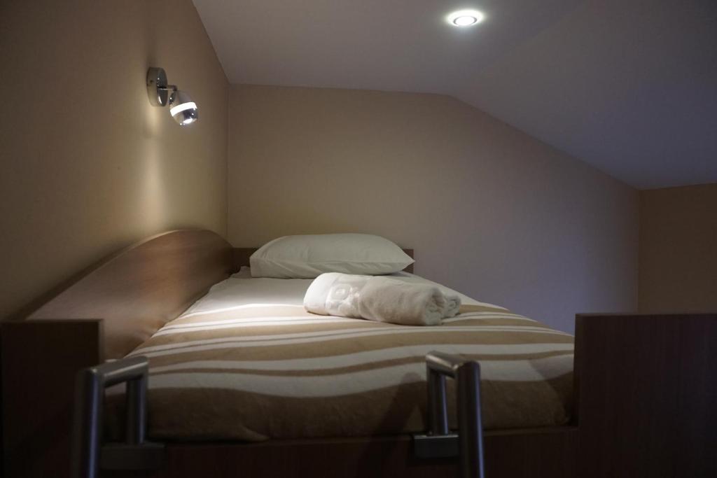 Postel nebo postele na pokoji v ubytování Rooms and Apartment Soča Kobarid