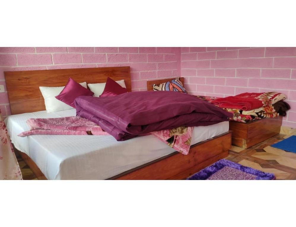 Postel nebo postele na pokoji v ubytování Atharva cottage, Joshimath