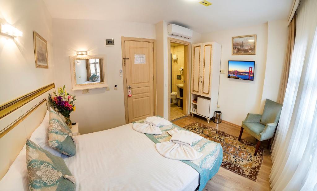 Postel nebo postele na pokoji v ubytování Sultan House