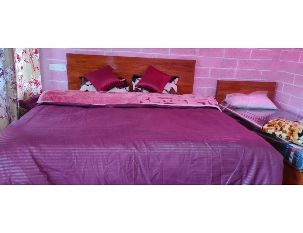 Postel nebo postele na pokoji v ubytování Atharva cottage, Joshimath
