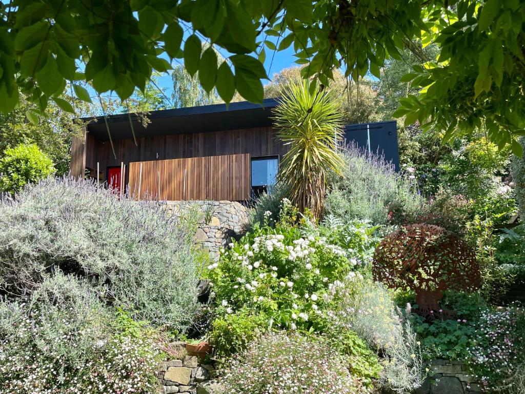 a house in the middle of a garden at North Hobart Oasis in West Hobart