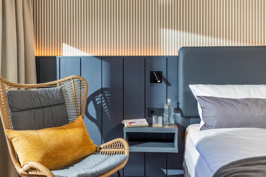 Postel nebo postele na pokoji v ubytování Arthotel Bakker