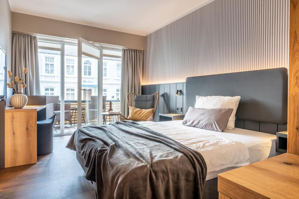 Postel nebo postele na pokoji v ubytování Arthotel Bakker