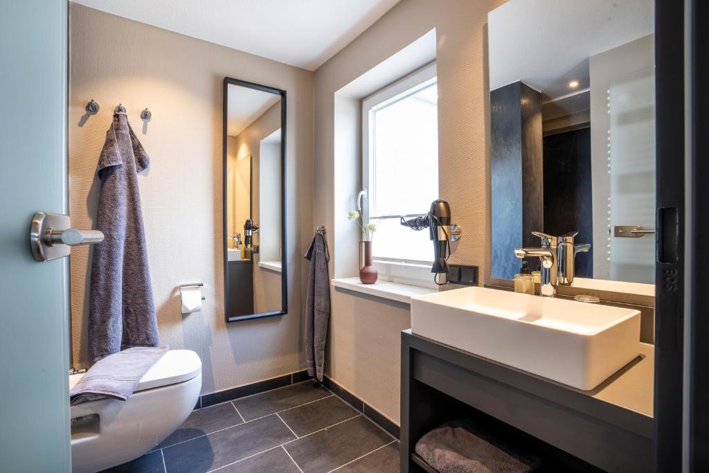 Koupelna v ubytování Arthotel Bakker