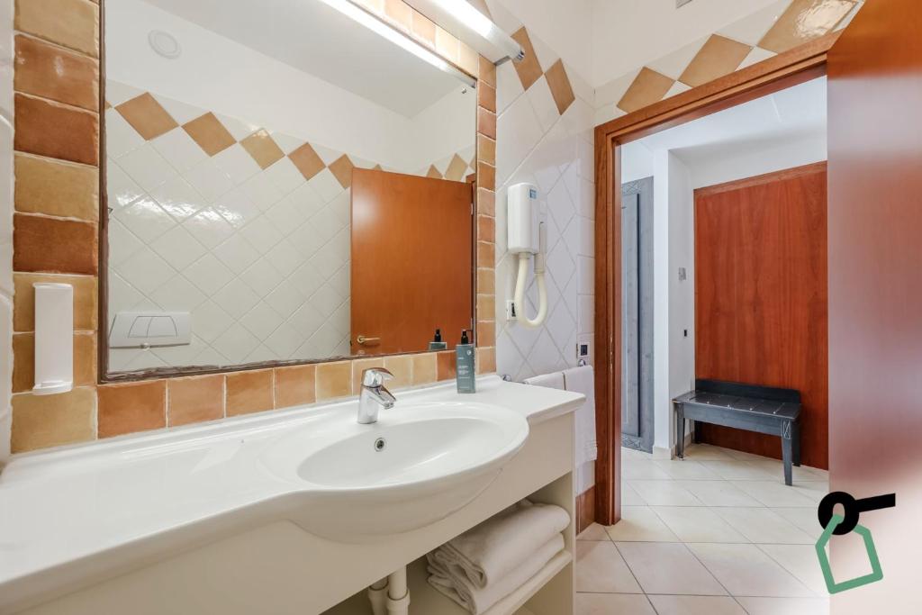 Koupelna v ubytování HOTIDAY Room Collection - Porto Azzurro