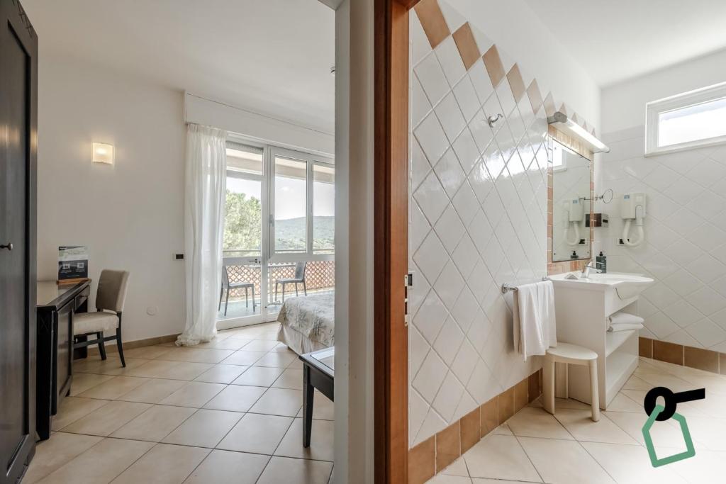Koupelna v ubytování HOTIDAY Room Collection - Porto Azzurro