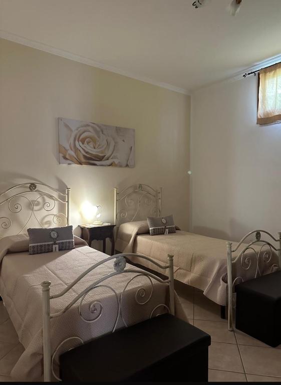 Postel nebo postele na pokoji v ubytování Donna Concetta casa vacanze