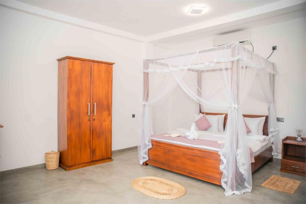 Postel nebo postele na pokoji v ubytování Hirigala Beach Resort