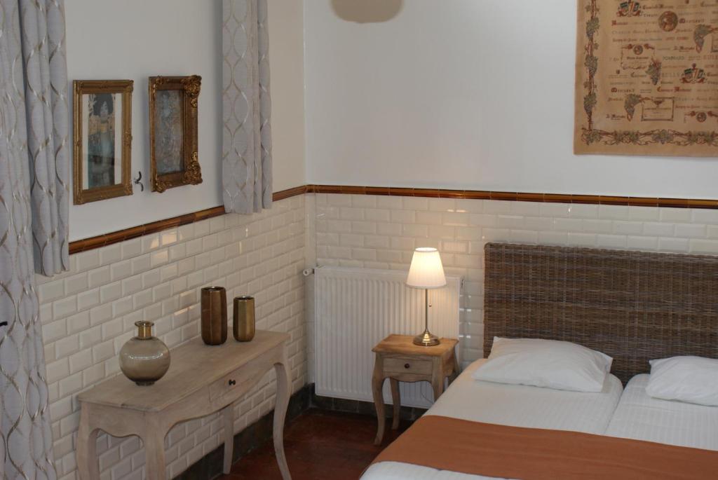 Postel nebo postele na pokoji v ubytování Manoir Bonpassage