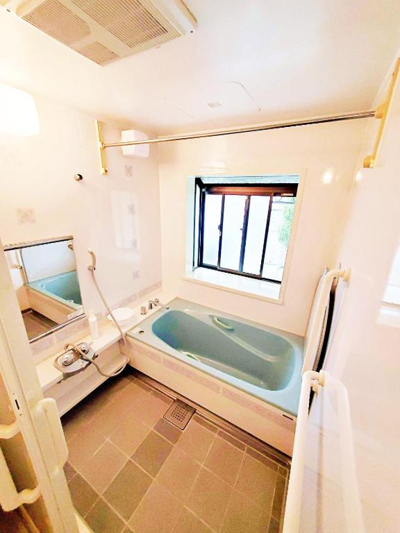 Postel nebo postele na pokoji v ubytování Guesthouse & Sharehouse カリマ安曇沓掛