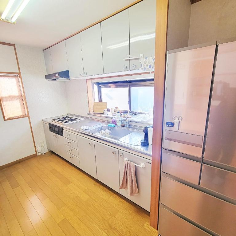 Kuchyň nebo kuchyňský kout v ubytování Guesthouse & Sharehouse カリマ安曇沓掛