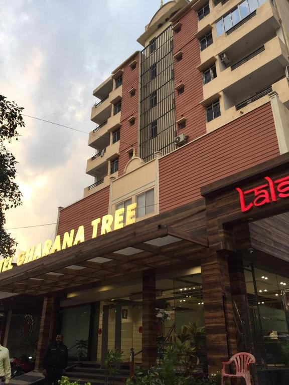 a building with a sign that reads camana tree at Hotel Gharana Tree in Gaya