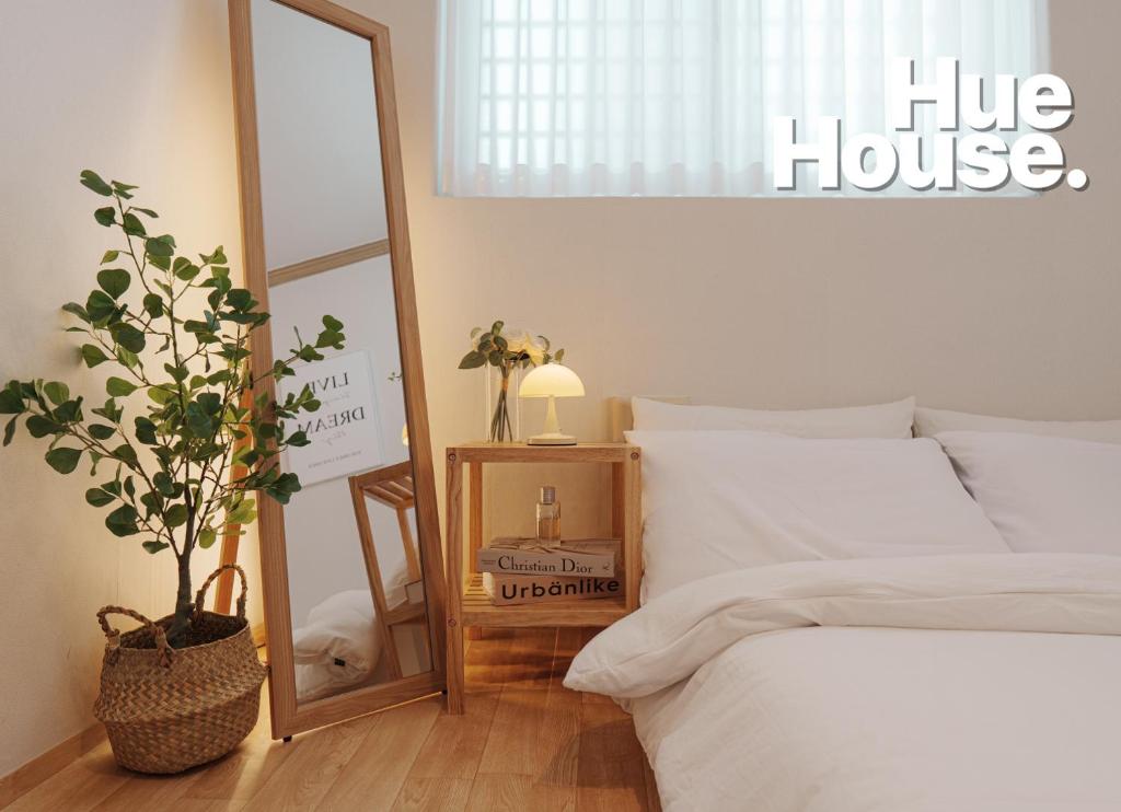 Postel nebo postele na pokoji v ubytování Hue house