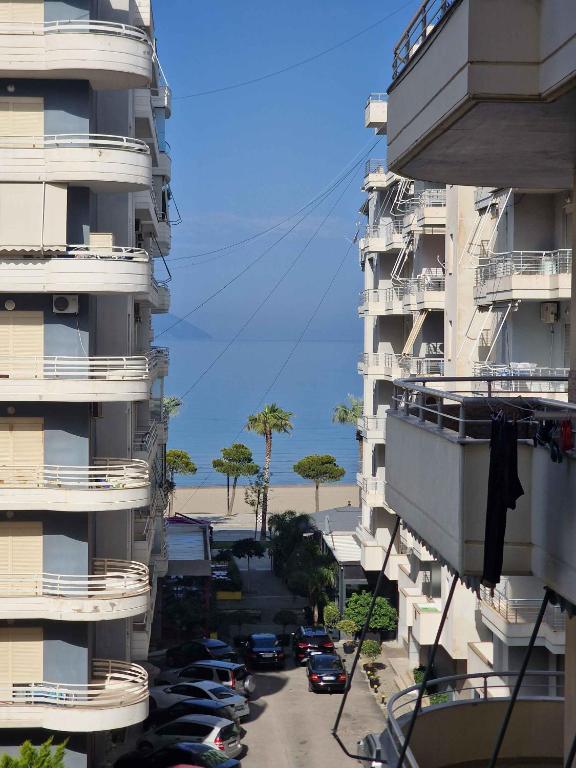 a view of a street between two tall buildings at Sea Grand Apartament in Vlorë