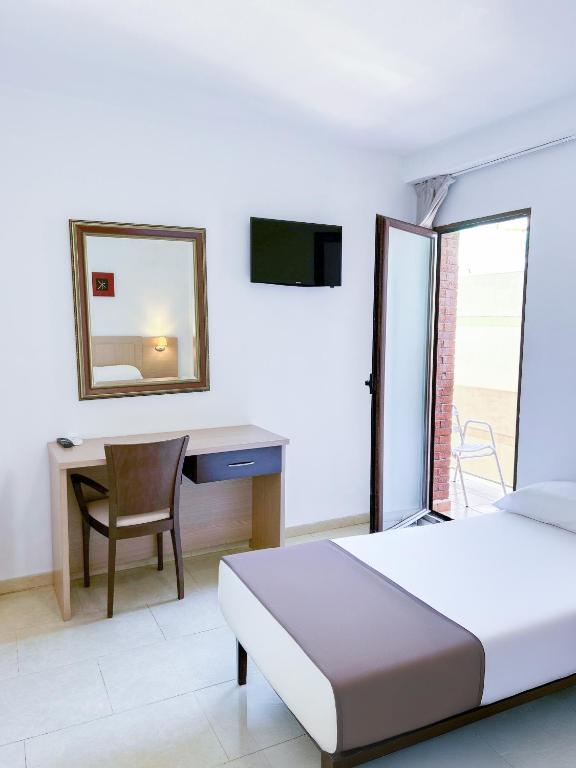 Postel nebo postele na pokoji v ubytování Hotel Primavera