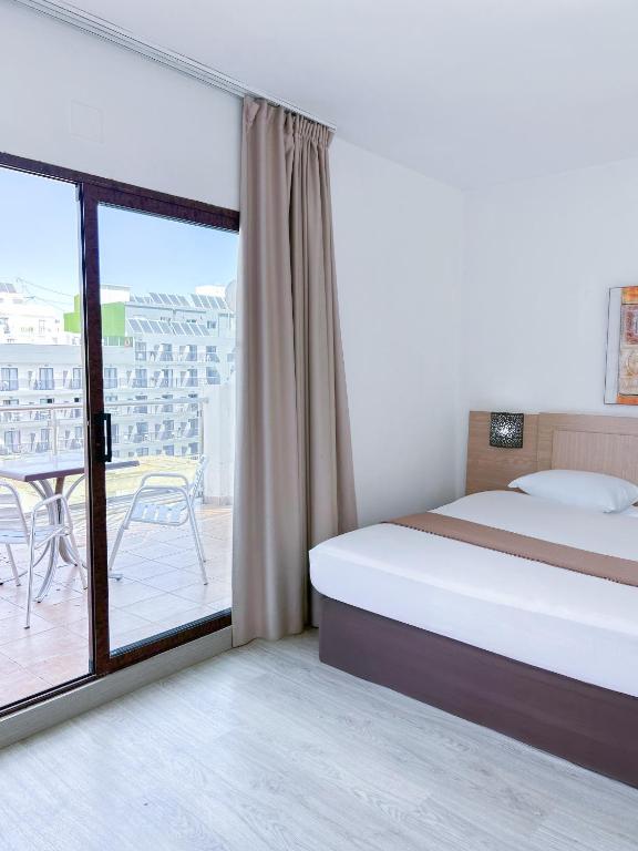 Postel nebo postele na pokoji v ubytování Hotel Primavera
