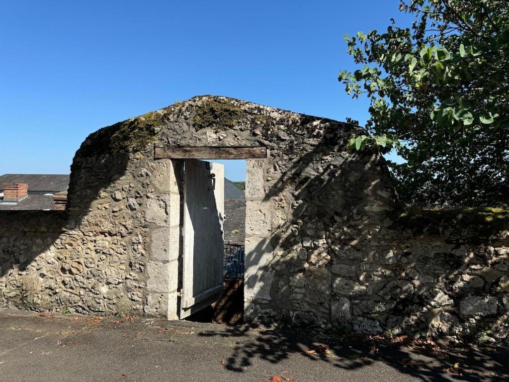 an old stone building with a door in it at Luxury apartment for 4 people in Blois