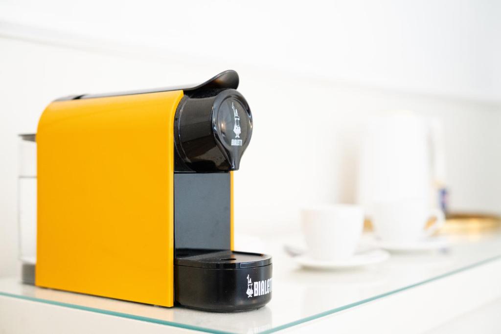 a coffee maker is sitting on a counter at Residenza Conte di Cavour & Rooftop in Florence