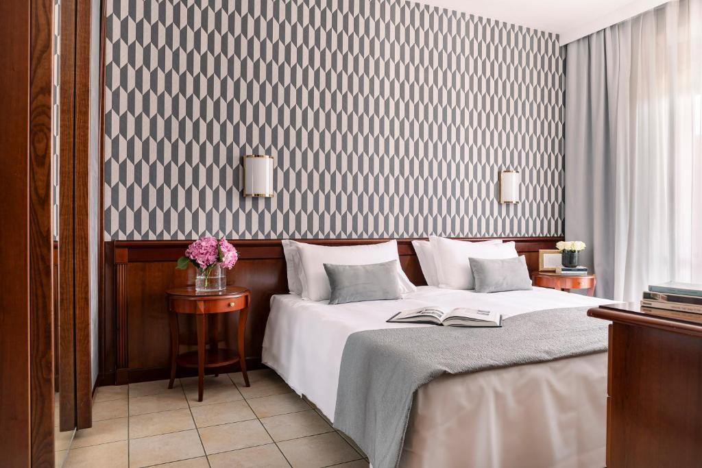 Cama o camas de una habitación en Ripamonti Residence & Hotel Milano