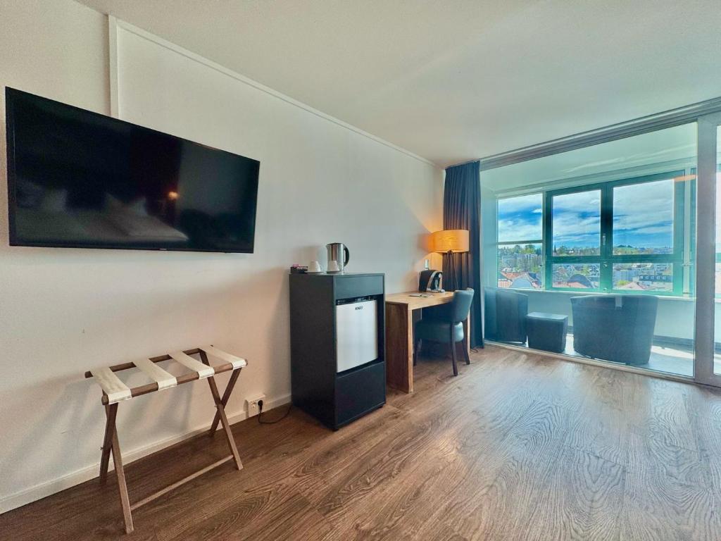 TV a/nebo společenská místnost v ubytování MY Parkhotel by AR Hotels