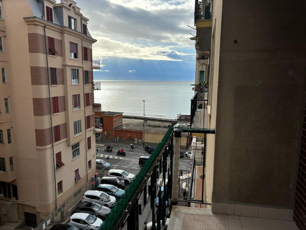 a view of the ocean from between two buildings at Casa vacanze di Carla in Savona