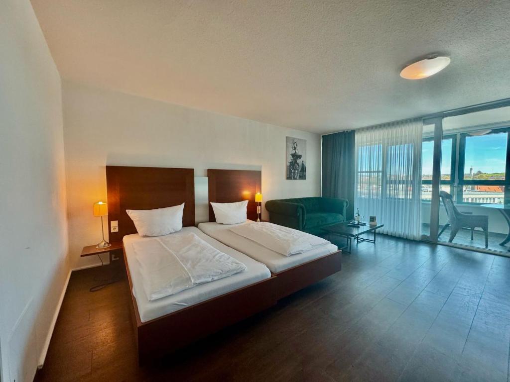 Postel nebo postele na pokoji v ubytování MY Parkhotel by AR Hotels